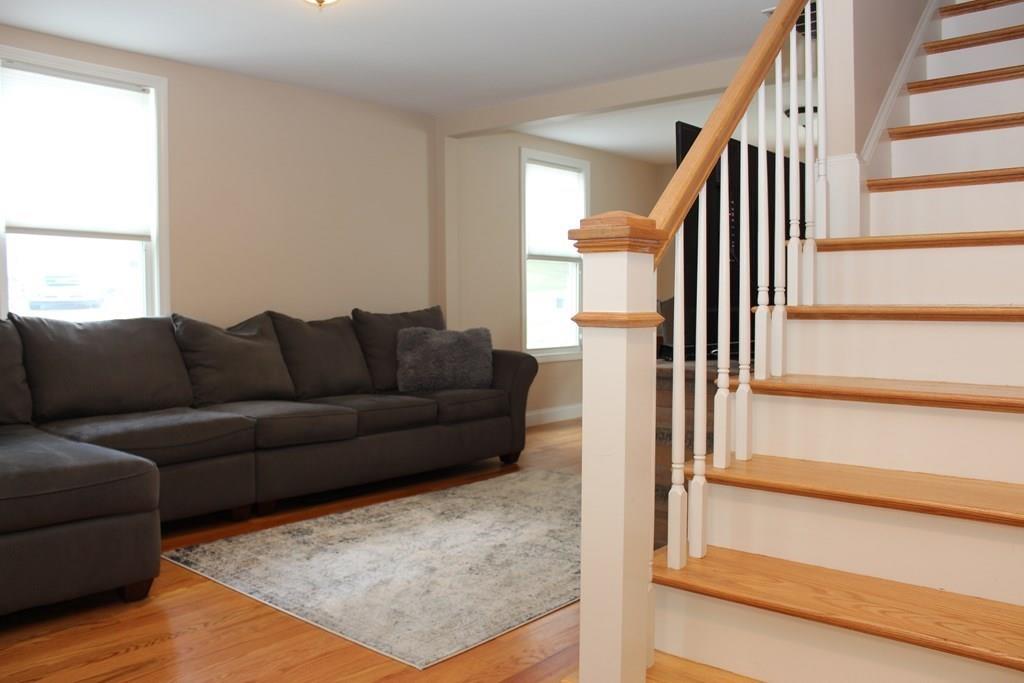 33 Riverside Drive North Reading, MA 01864 - Photo 14 of 37 a living room with furniture and wooden floor