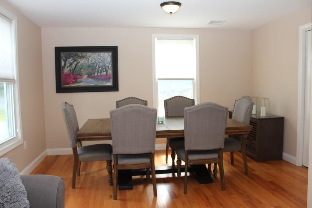 33 Riverside Drive North Reading, MA 01864 - Photo 16 of 37 a view of a dining room with furniture window and wooden floor