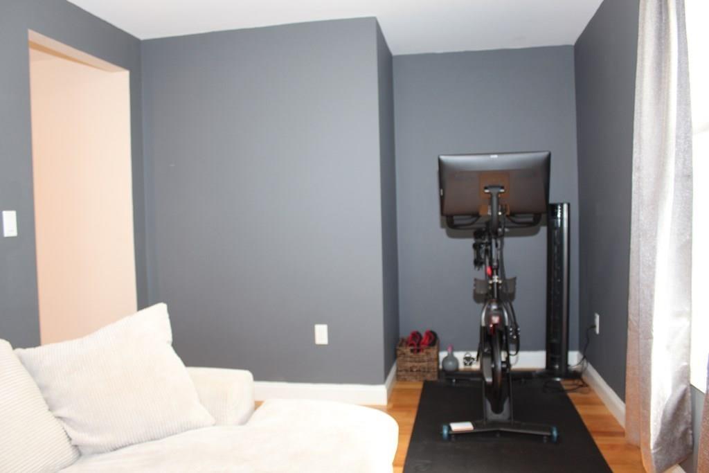 33 Riverside Drive North Reading, MA 01864 - Photo 20 of 37 a living room with furniture and a window