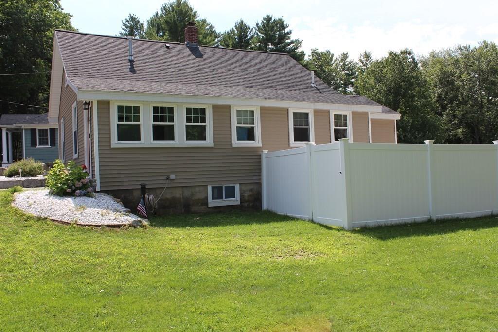 33 Riverside Drive North Reading, MA 01864 - Photo 3 of 37 a view of a house with a yard and sitting area