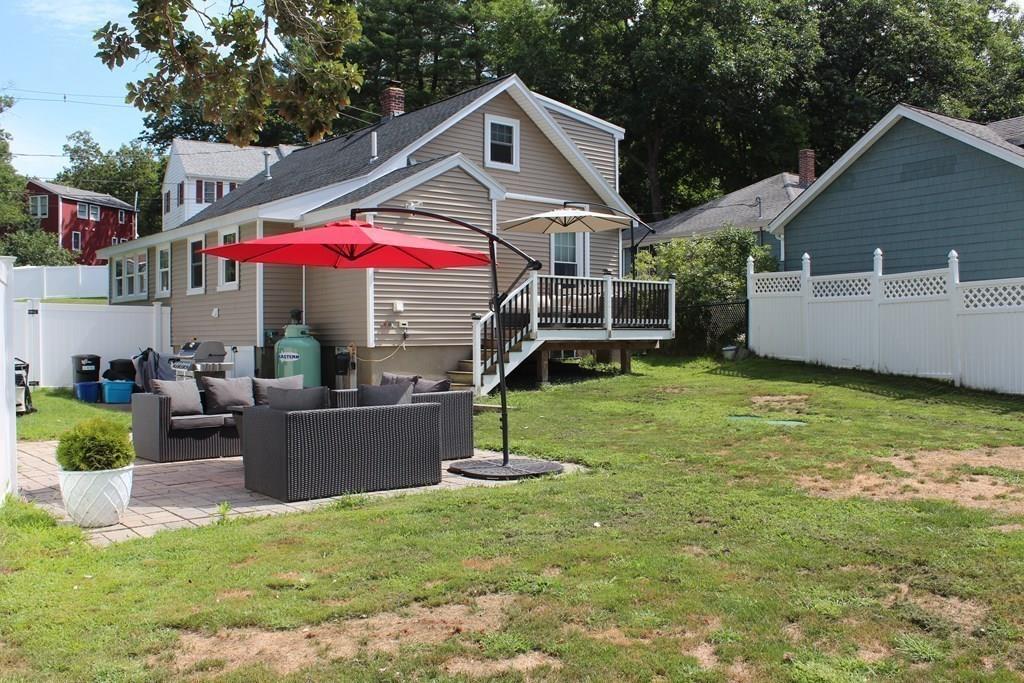 33 Riverside Drive North Reading, MA 01864 - Photo 32 of 37 a front view of a house with a yard