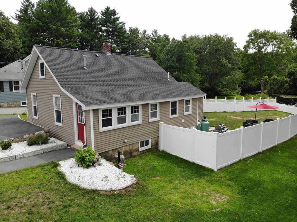 33 Riverside Drive North Reading, MA 01864 - Photo 4 of 37 a aerial view of a house with a yard and potted plants
