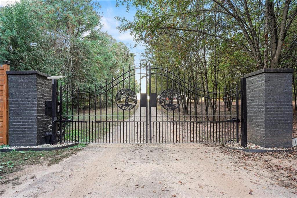 280 Etheridge Road Auburn, GA 30011 - Photo 2 of 7 a view of a backyard with a fence and trees