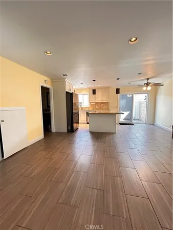 a view of a living room with wooden floor