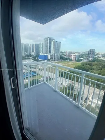 a view of balcony with furniture