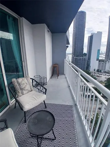 a view of balcony with furniture