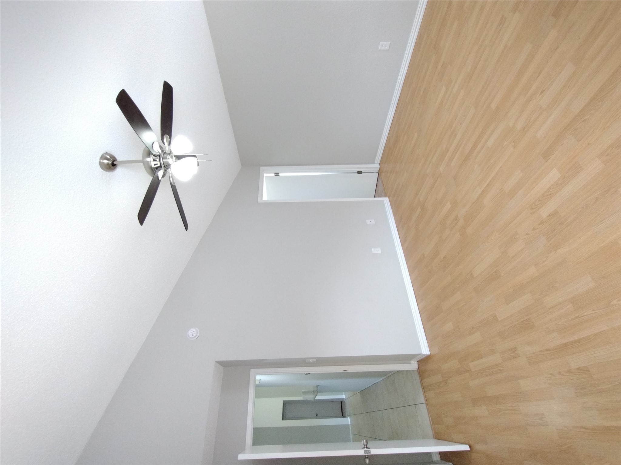 1813 Laurel Path Round Rock, TX 78664 - Photo 24 of 35 A generously sized bedroom with vaulted ceilings, natural wood-toned flooring, and a contemporary ceiling fan for year-round comfort.
