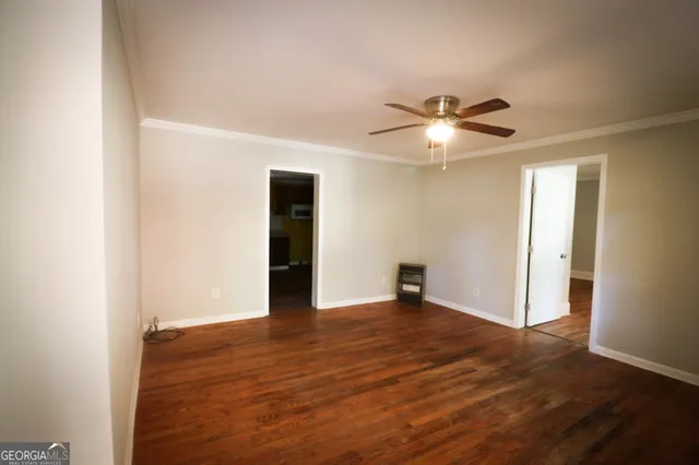 a view of a kitchen with a refrigerator and a sink