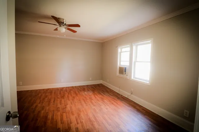 a view of backyard with wooden deck