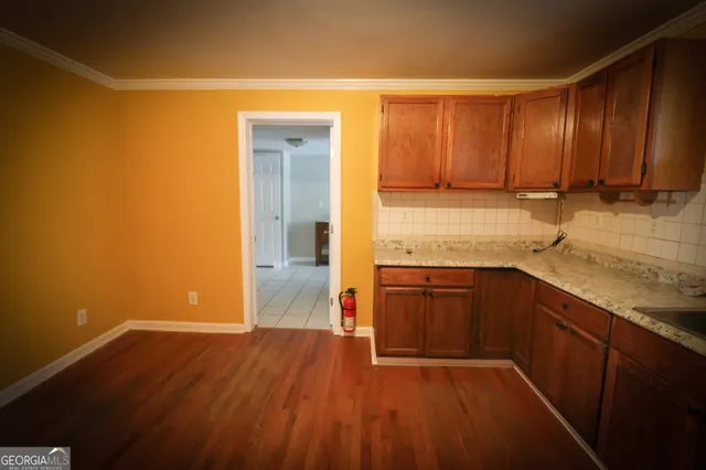 a bathroom with a granite countertop shower and a toilet
