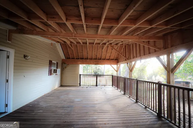 a view of a white house with a yard