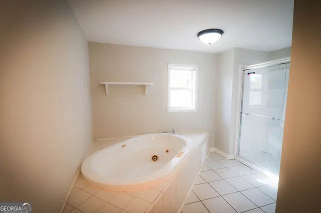 a view of a yard with a house in the background