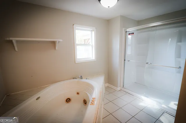 a view of a house with a yard and the trees