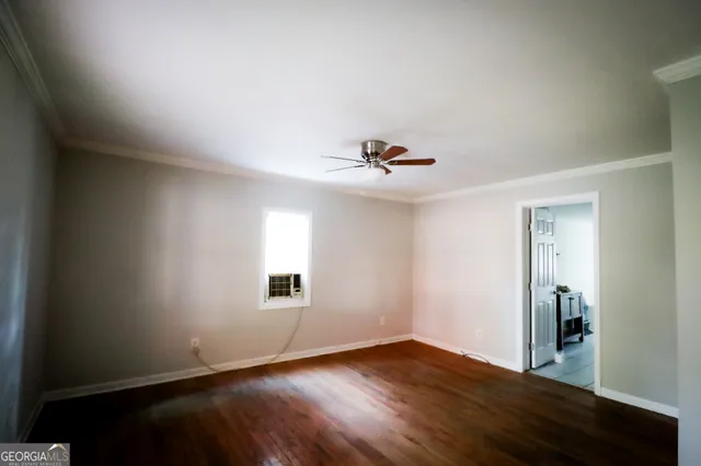a front view of a house with a yard covered in snow