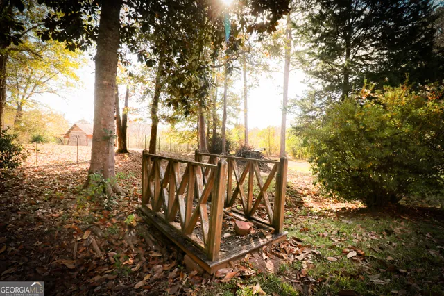 a front view of a house with a yard covered in snow