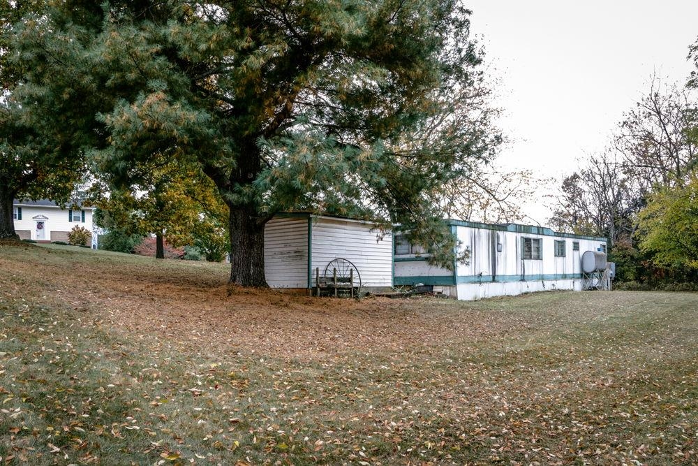 1320 Smithland Road Harrisonburg, VA 22802 - Photo 3 of 12 a house with trees in front of it