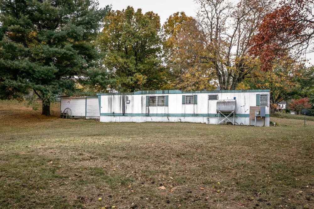 1320 Smithland Road Harrisonburg, VA 22802 - Photo 8 of 12 a view of a house with backyard and trees