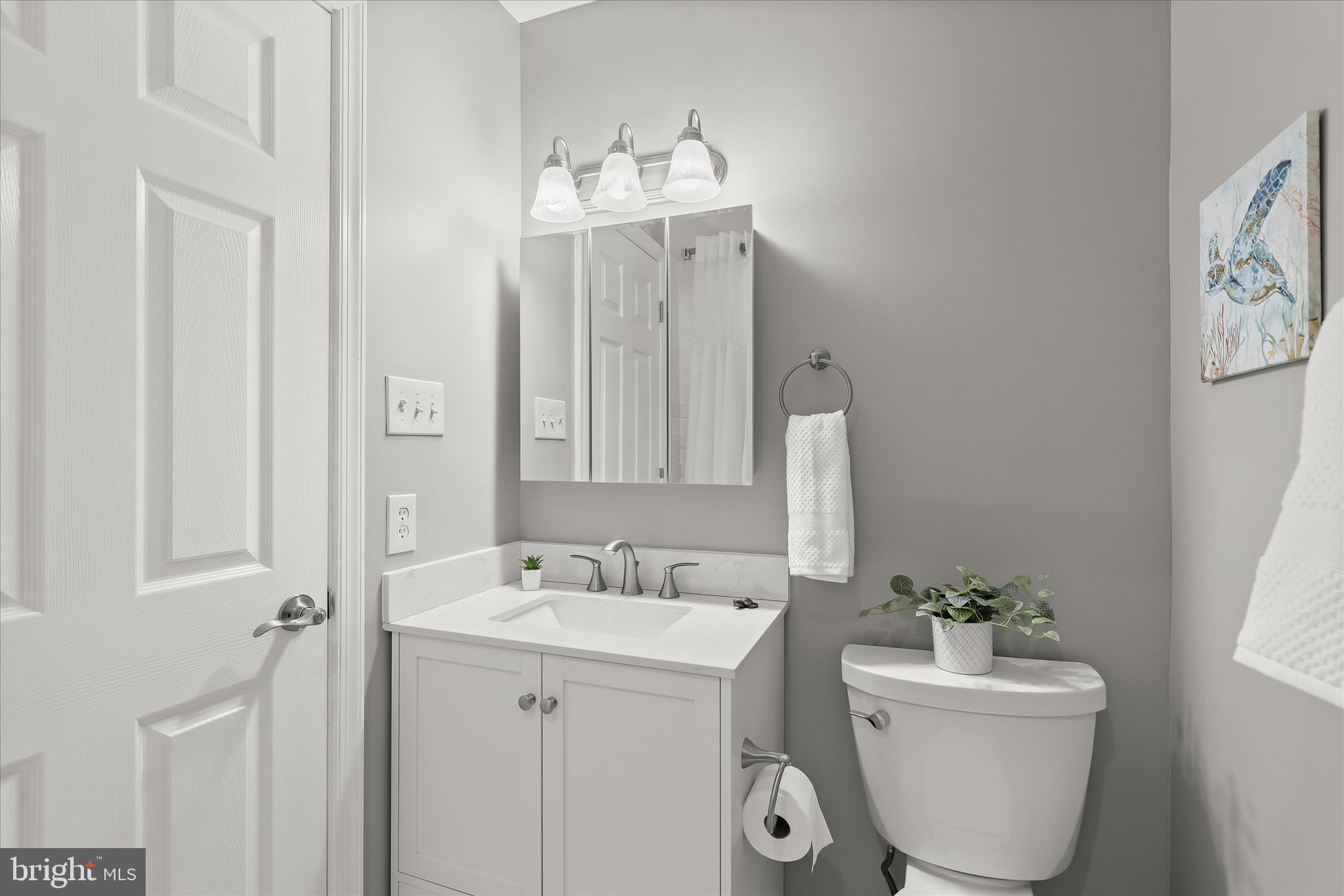 792 Match Point Drive Arnold, MD 21012 - Photo 21 of 43 a bathroom with a sink and mirror with toilet