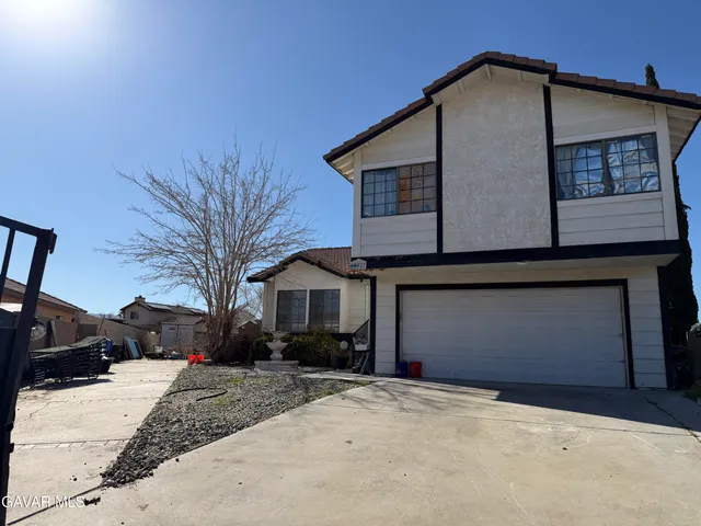 a building with potted plants in front of it
