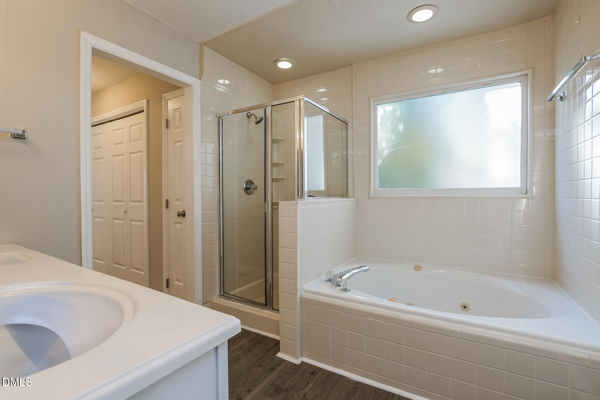 1909 Kushima Court Raleigh, NC 27604 - Photo 14 of 24 a bathroom with a bathtub and a sink