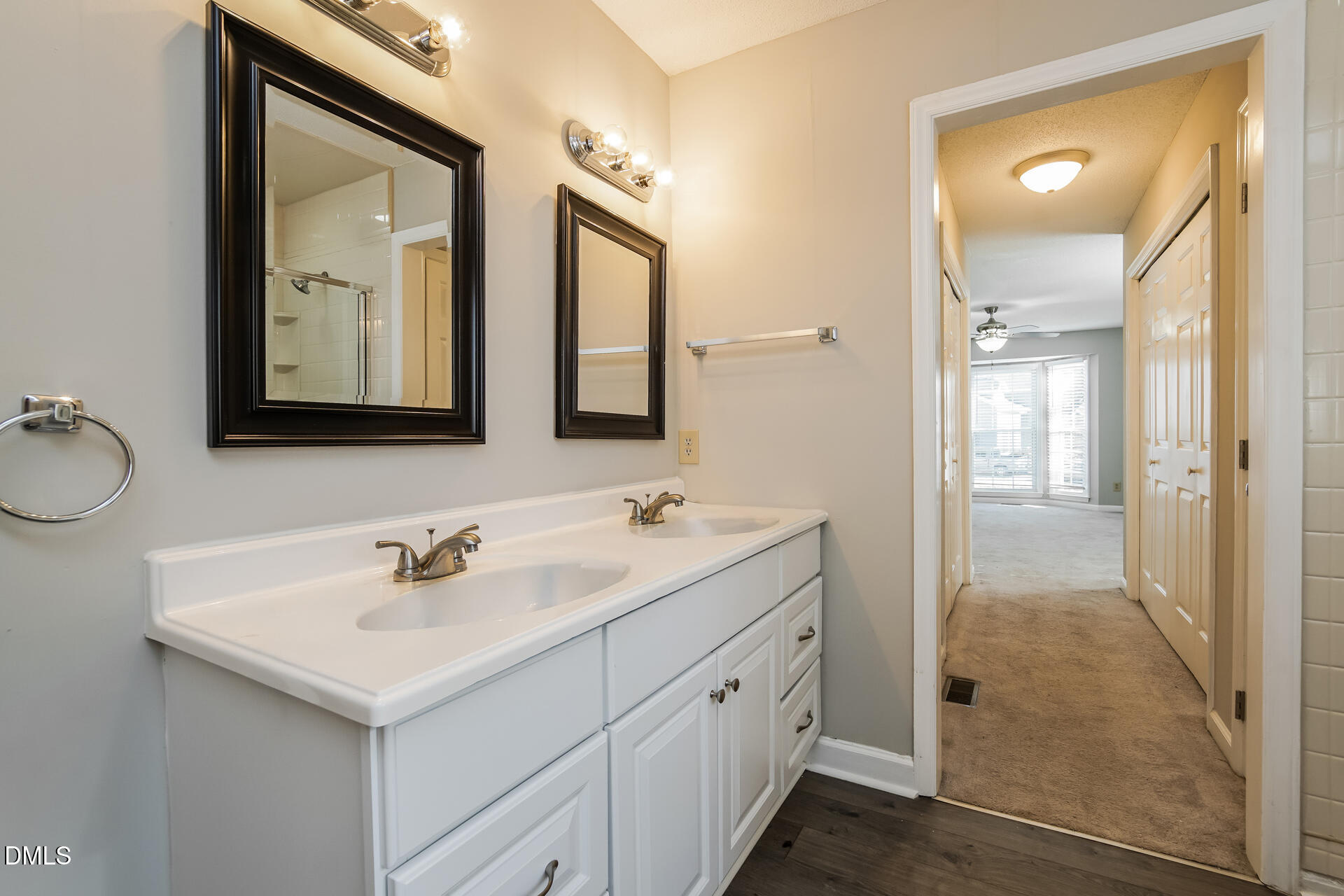 1909 Kushima Court Raleigh, NC 27604 - Photo 15 of 24 a bathroom with 2 sink and a mirror