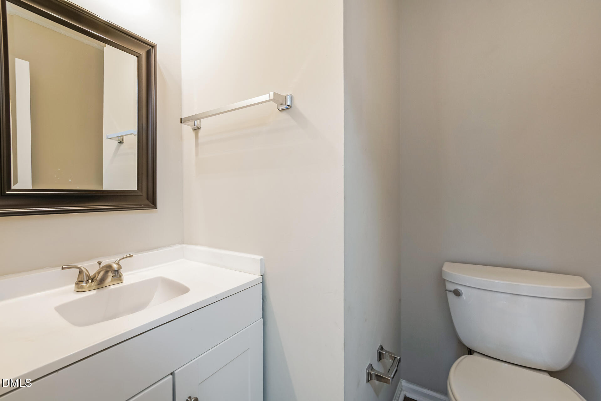 1909 Kushima Court Raleigh, NC 27604 - Photo 18 of 24 a bathroom with a toilet sink and mirror