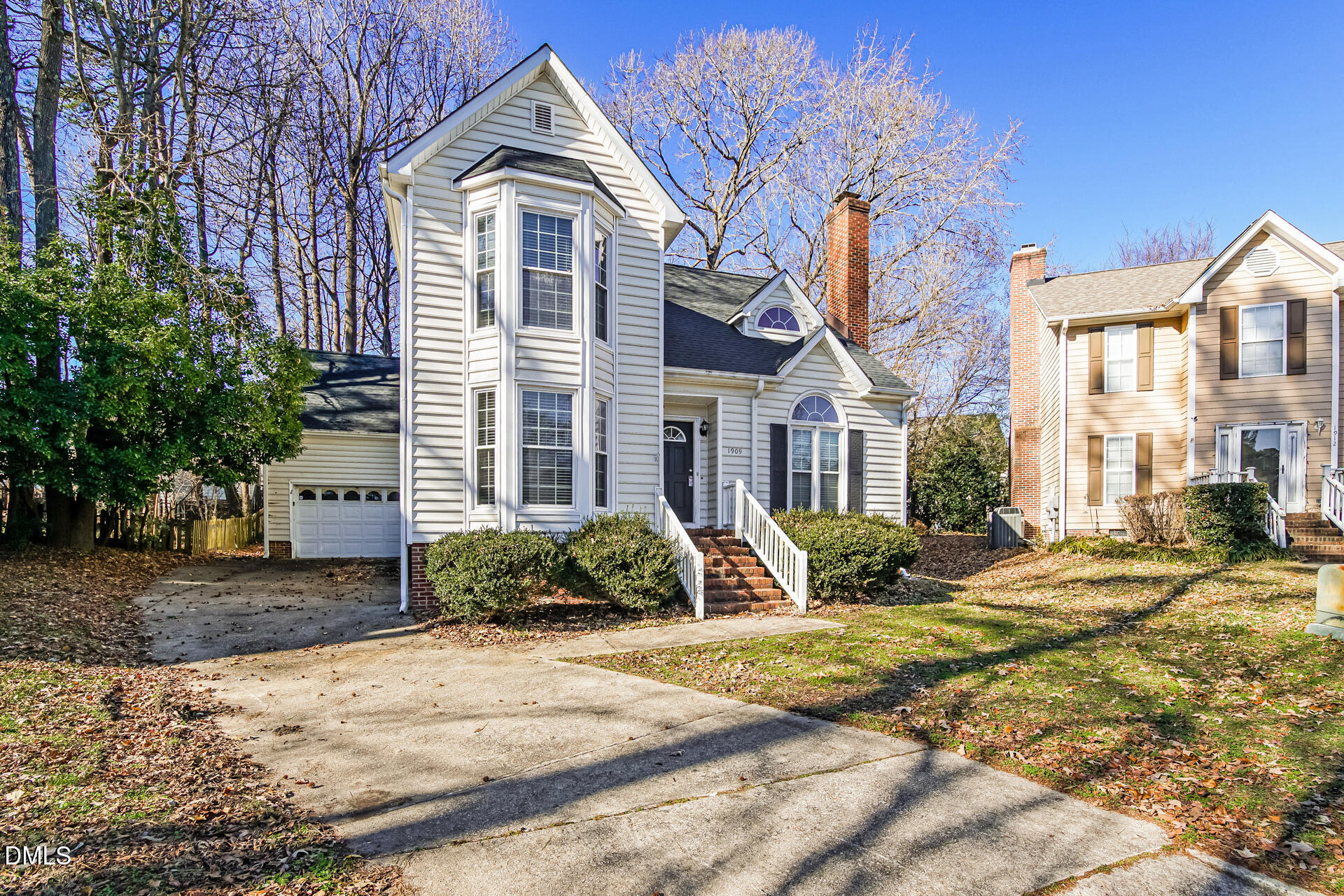 1909 Kushima Court Raleigh, NC 27604 - Photo 2 of 24 a front view of a house with a yard