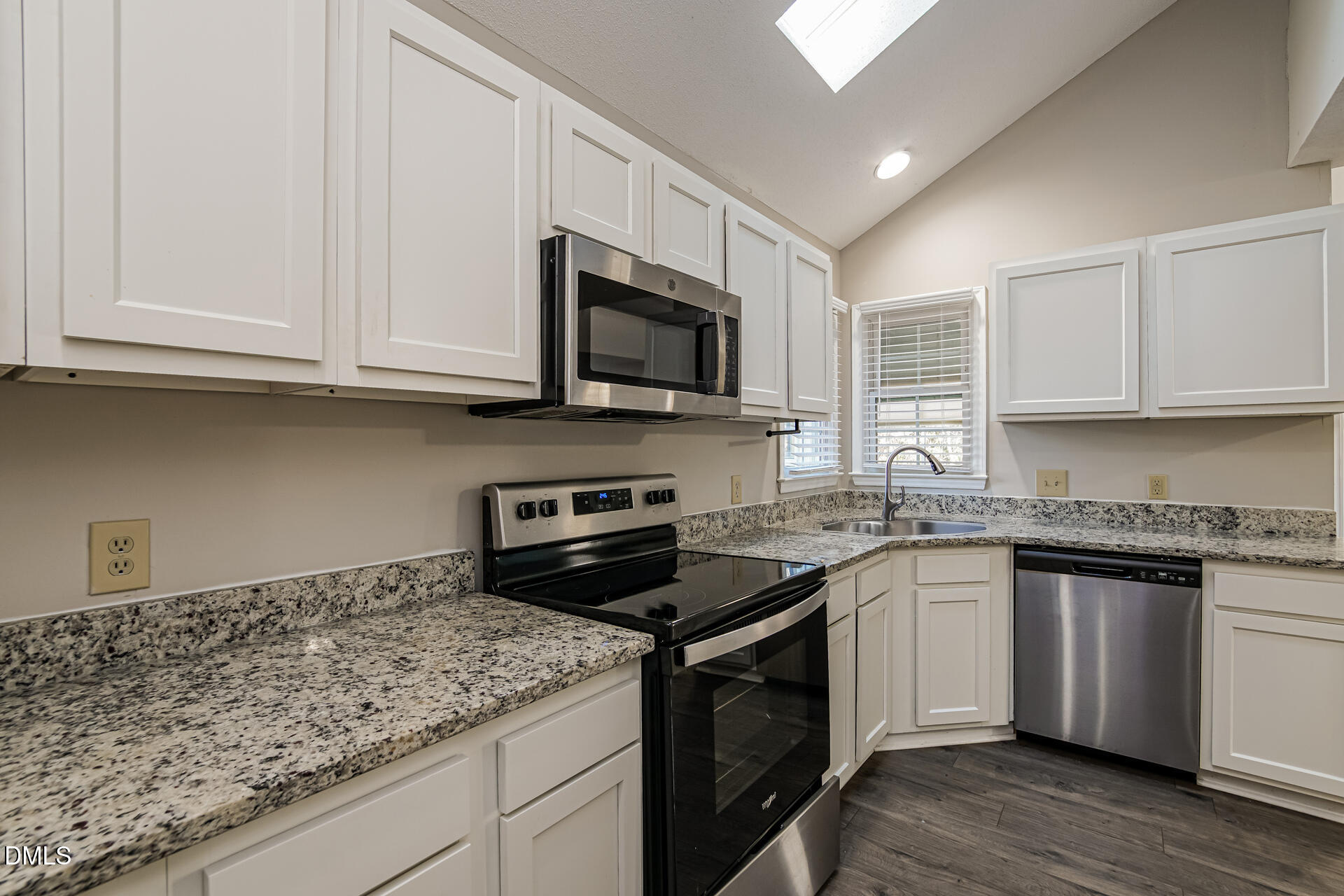 1909 Kushima Court Raleigh, NC 27604 - Photo 8 of 24 a kitchen with stainless steel appliances granite countertop a sink stove and microwave