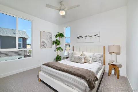 a bedroom with bed and window