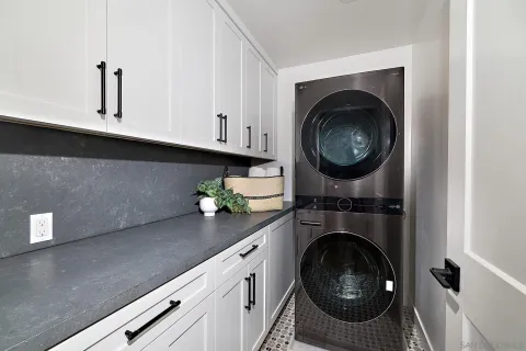 a kitchen with sink and cabinets