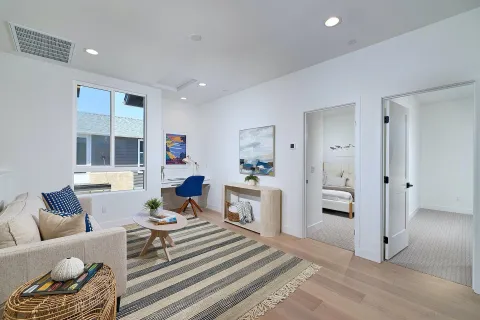 a living room with furniture and a table