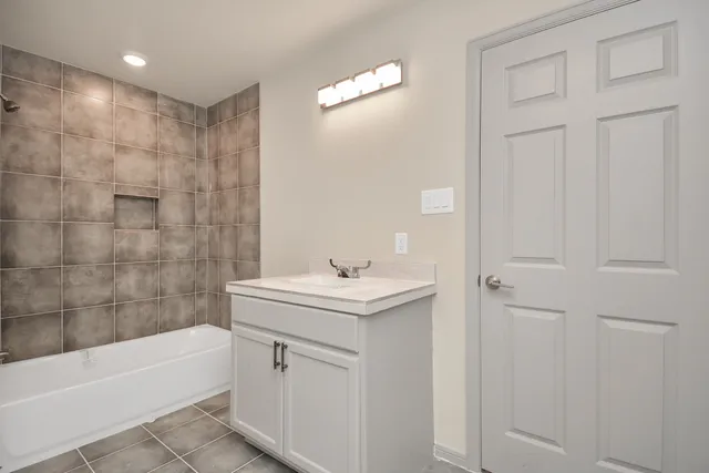 a bathroom with a sink and a bathtub