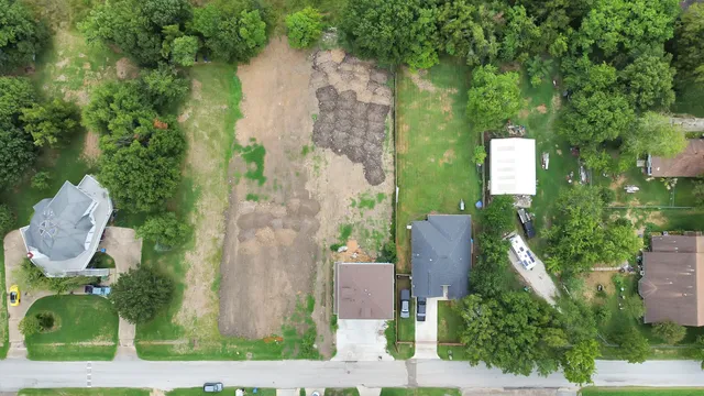 an aerial view of a house with outdoor space swimming pool and lake view
