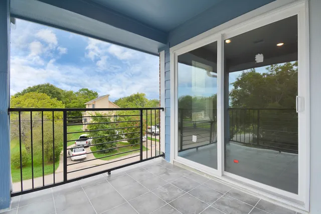 a view of a glass door with a yard