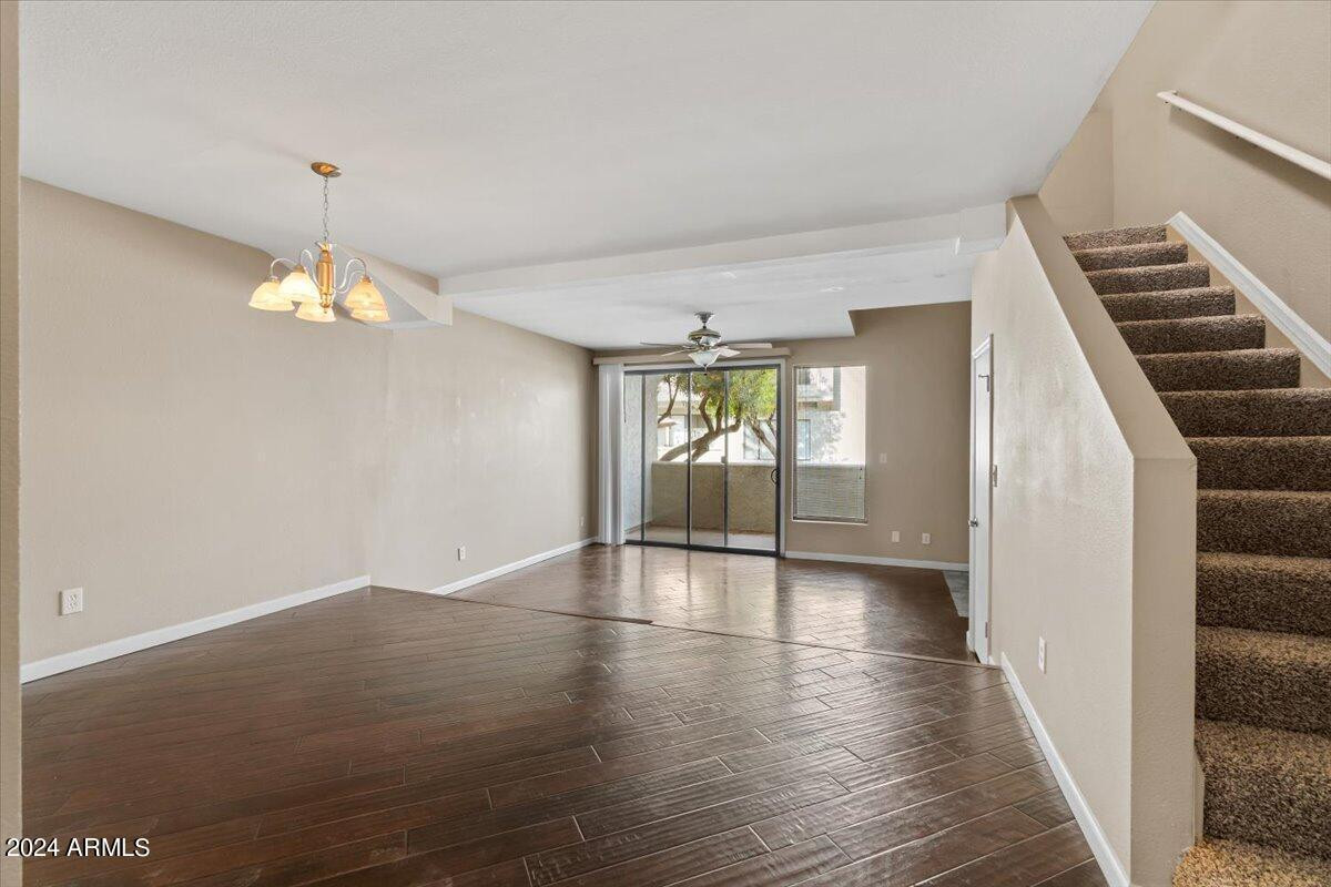 10115 East Mountain View Road, Unit 1102 Scottsdale, AZ 85258 - Photo 5 of 31 wooden floor in an empty room with a window