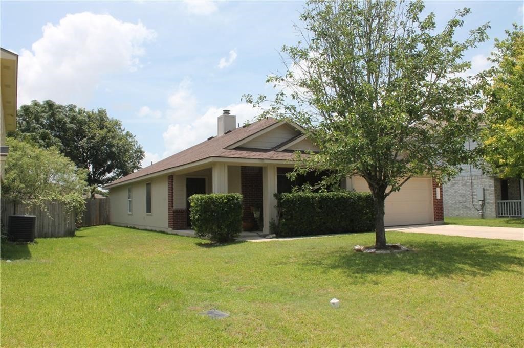 150 Madisons Way Buda, TX 78610 - Photo 1 of 11 a front view of a house with a yard