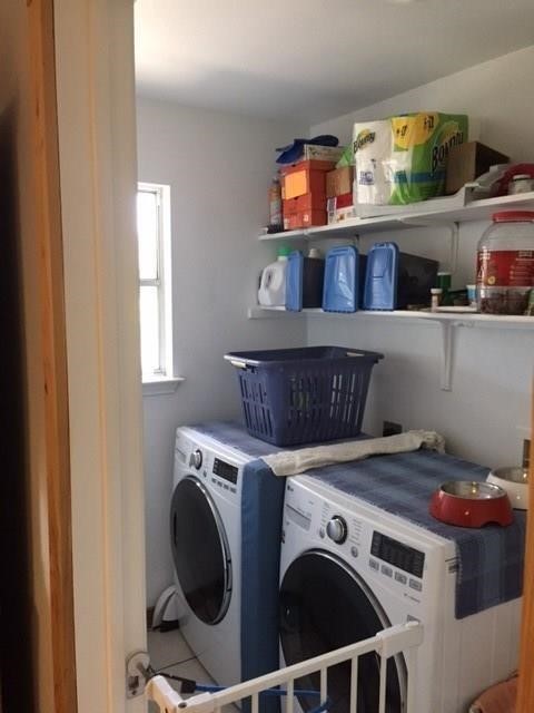 150 Madisons Way Buda, TX 78610 - Photo 9 of 11 a utility room with dryer and washer
