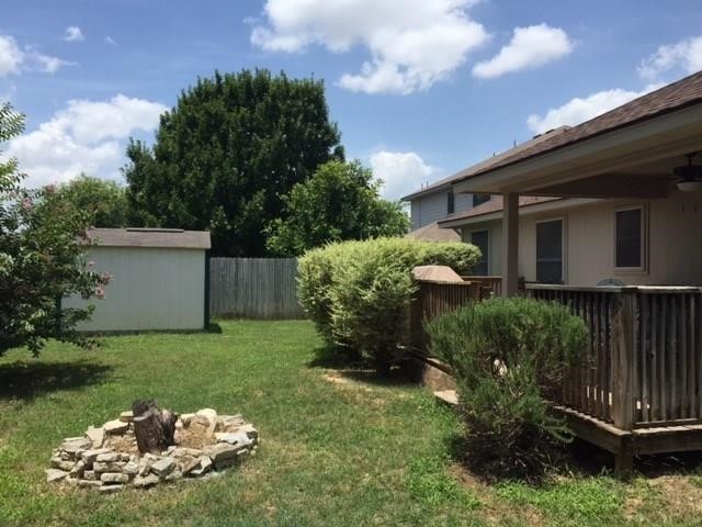150 Madisons Way Buda, TX 78610 - Photo 10 of 11 a front view of a house with garden