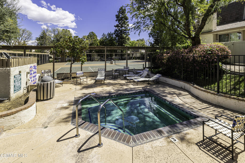 a view of swimming pool with a patio