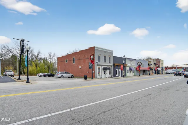 a view of a street with a building in the background