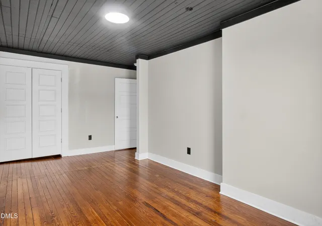 a view of room with hardwood floor