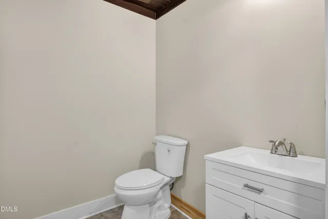 a bathroom with a toilet and a sink