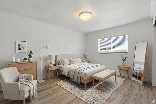 7910 Woolley Way Magna, UT 84044 - Photo 12 of 26 This space area has been virtually staged. Light-filled room featuring wide-plank wood-finish flooring, a window with horizontal blinds, ceiling-mounted lighting, and crown molding