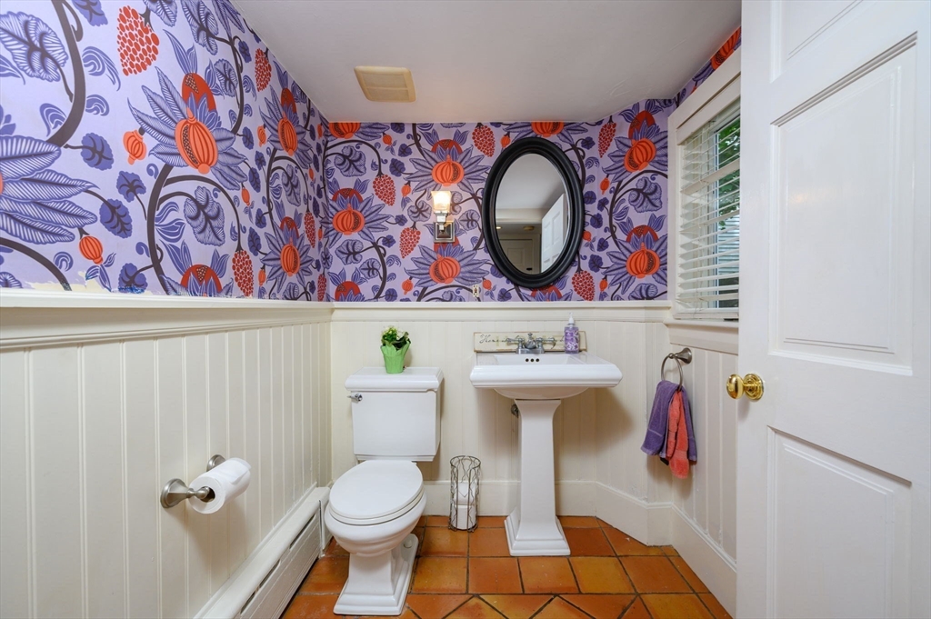 651 Main Street Hingham, MA 02043 - Photo 11 of 42 a bathroom with a toilet and a sink