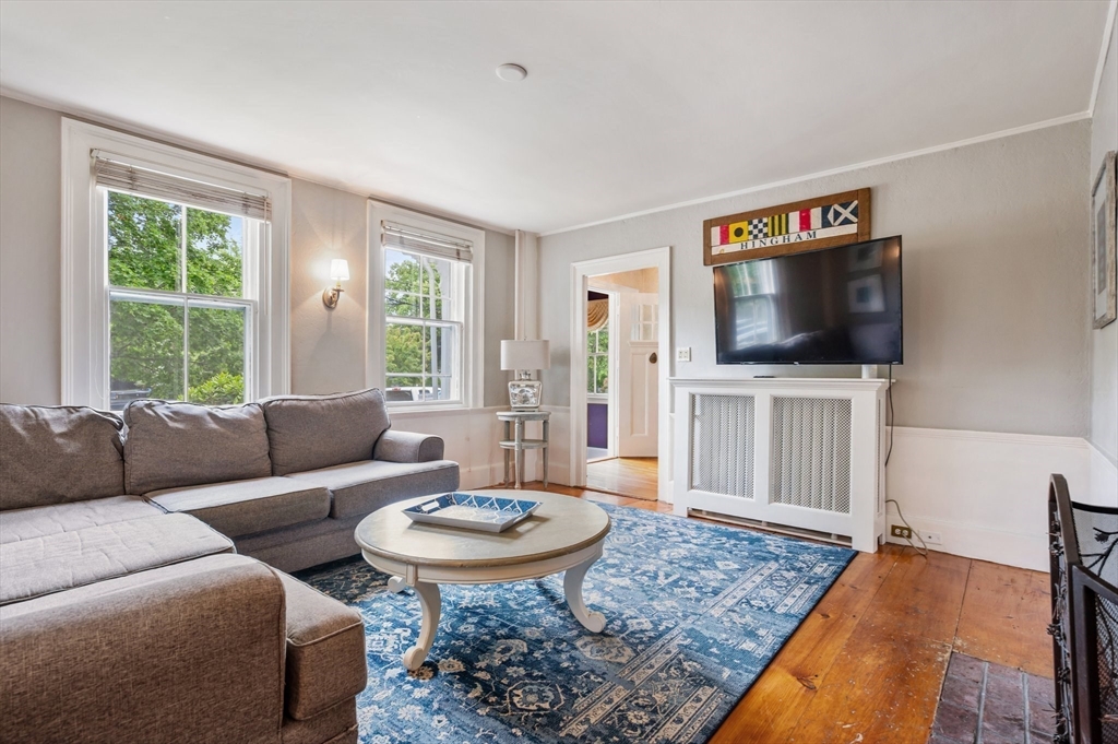 651 Main Street Hingham, MA 02043 - Photo 16 of 42 a living room with furniture and a flat screen tv