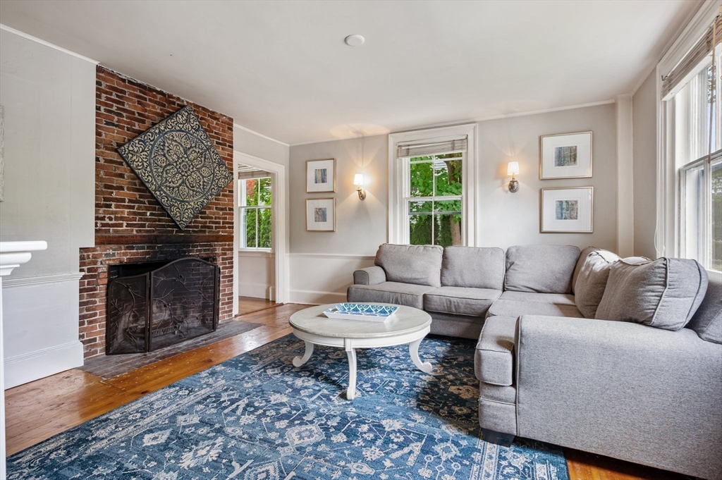 651 Main Street Hingham, MA 02043 - Photo 17 of 42 a living room with furniture a window and a fireplace