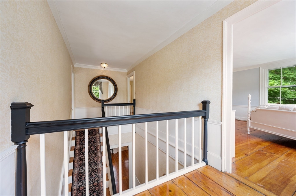 651 Main Street Hingham, MA 02043 - Photo 24 of 42 a view of a porch with a table and chairs