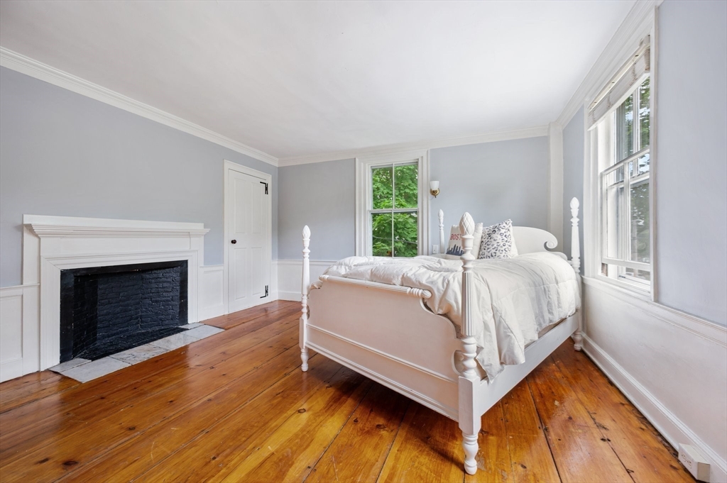 651 Main Street Hingham, MA 02043 - Photo 25 of 42 a bed sitting in a spacious bedroom next to a window