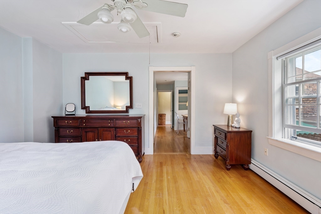 651 Main Street Hingham, MA 02043 - Photo 27 of 42 a bedroom with a bed and window