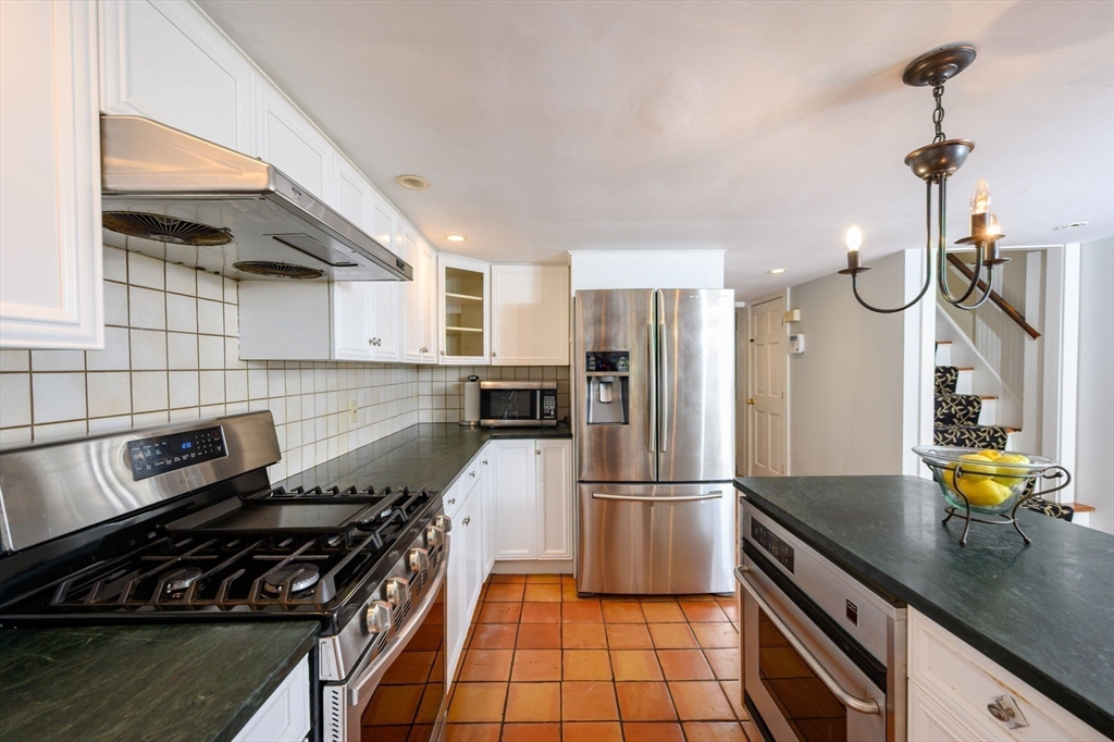 651 Main Street Hingham, MA 02043 - Photo 3 of 42 a kitchen with a refrigerator a stove and a sink